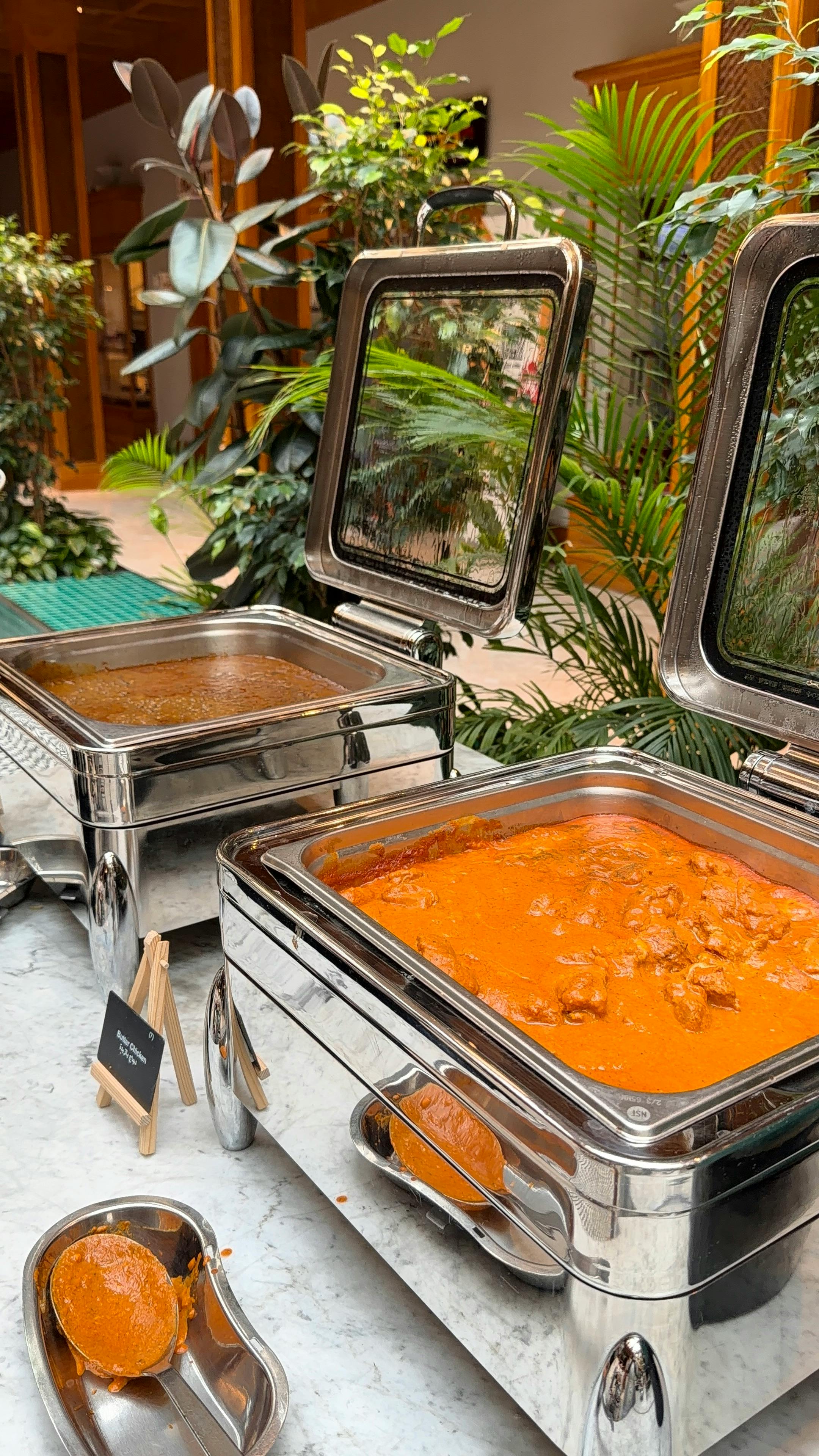 A flavorful assortment of Indian cuisine with various dishes on a serving tray, highlighting vibrant spices and textures.