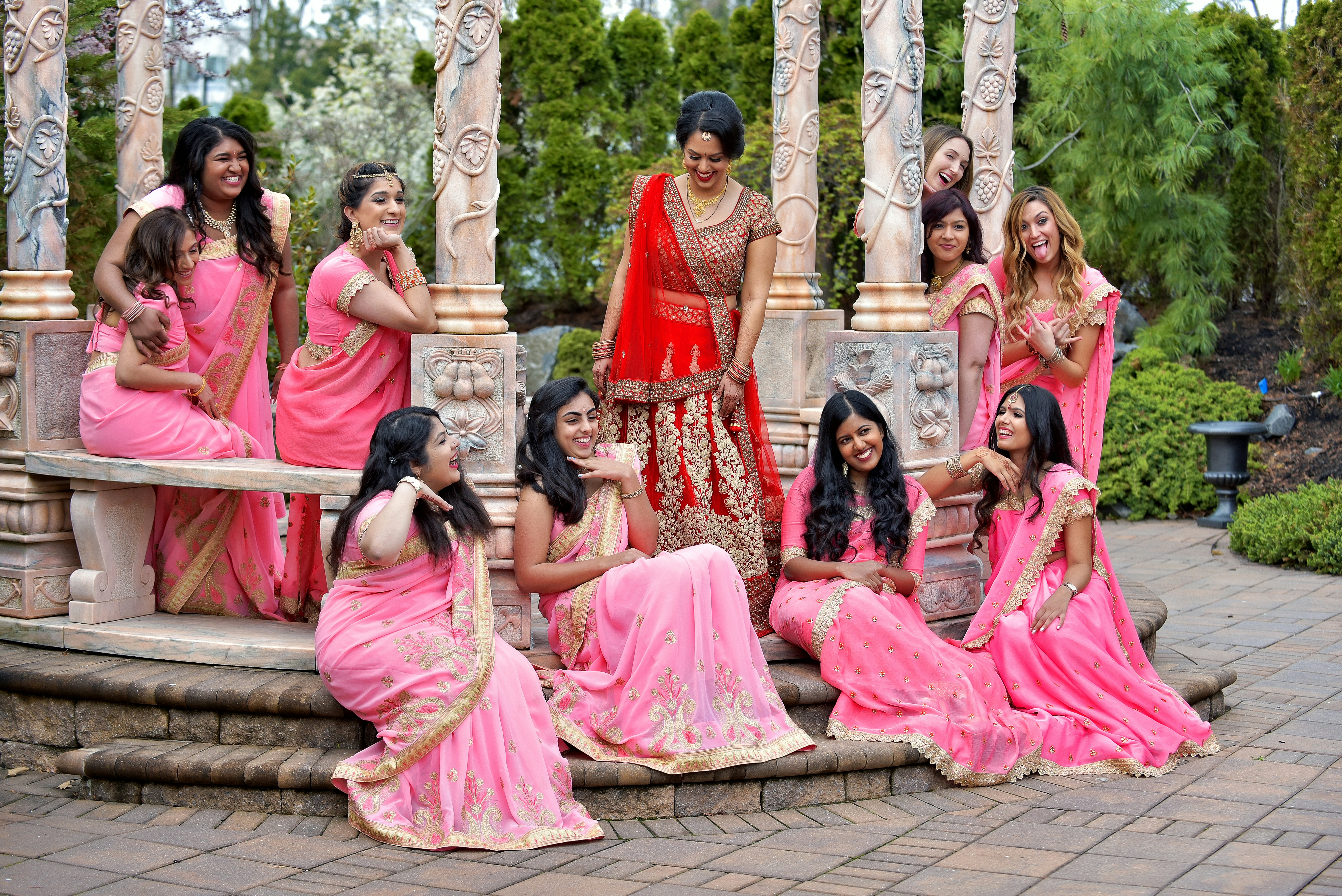 Group of guests at an Indian wedding including non-Indian attendees dressed in colorful formal outfits