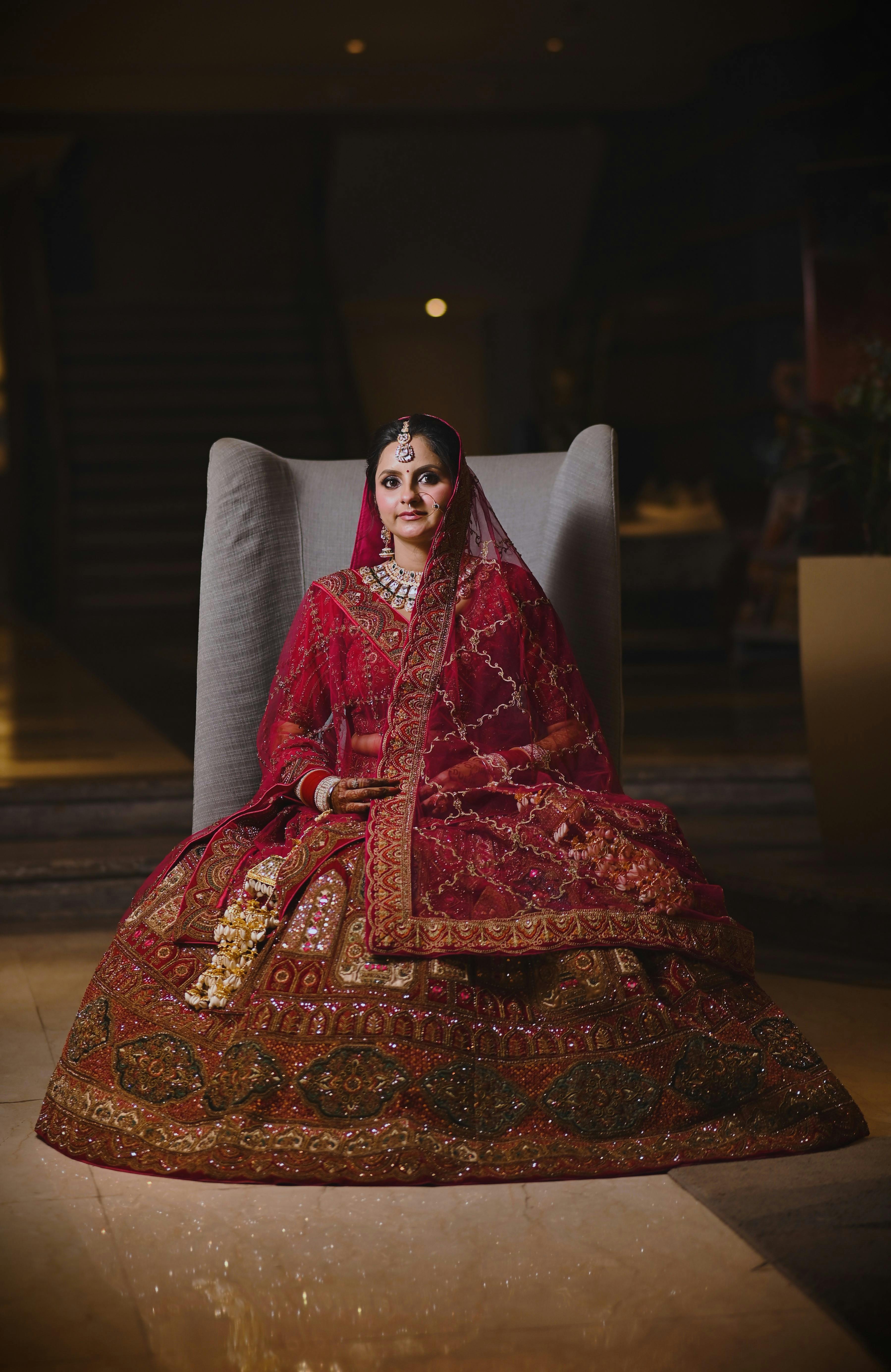 Indian bride in a richly embroidered lehenga during a bridal portrait session